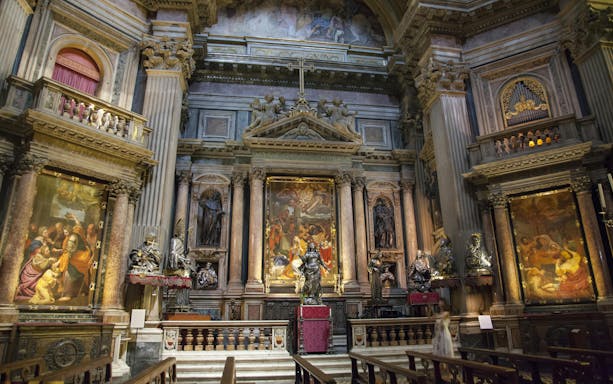 Royal Chapel of the Treasure of San Gennaro interior with ornate altar and religious paintings.