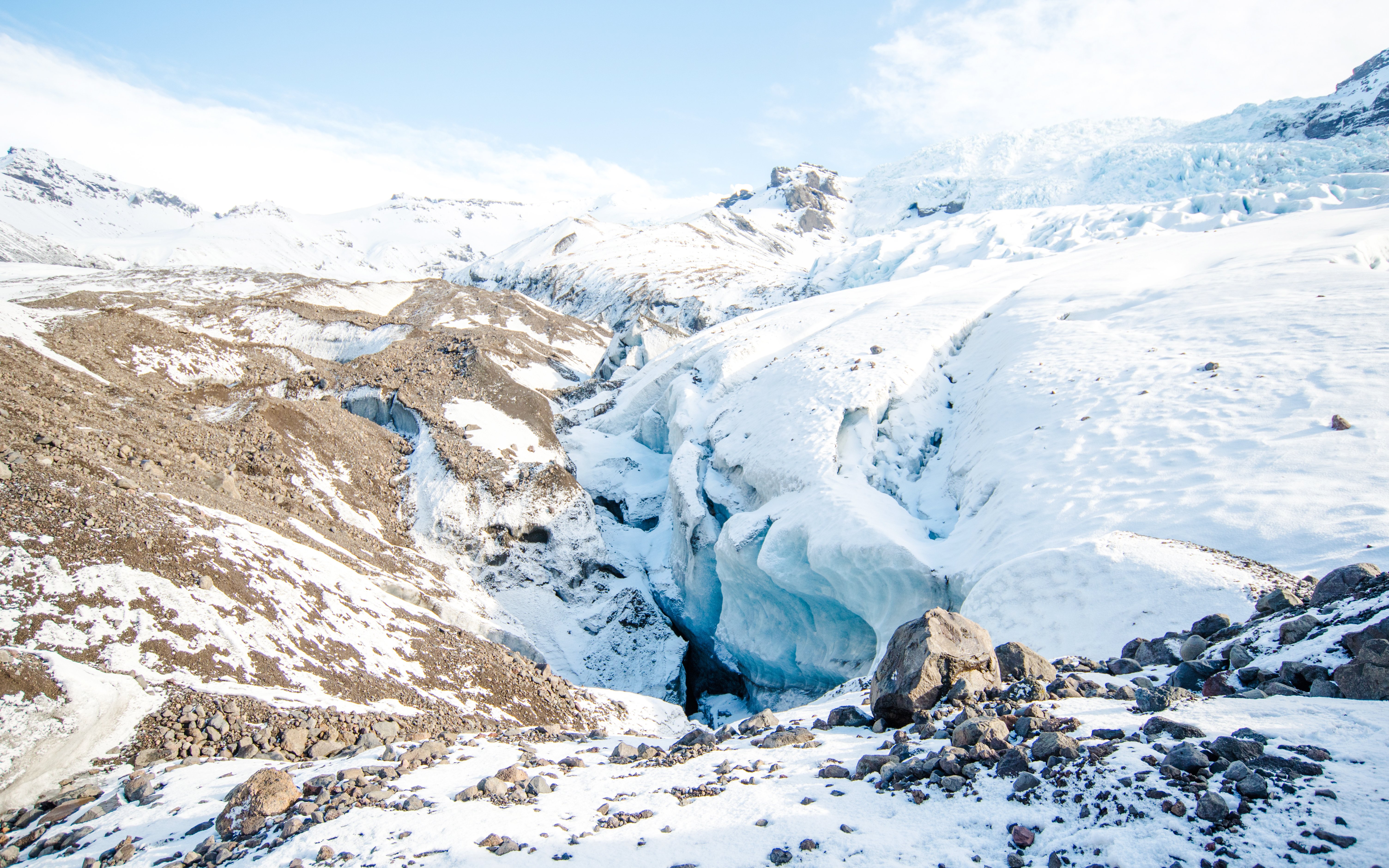Falljokull glacier landscape in Iceland with snow-covered terrain and ice formations.