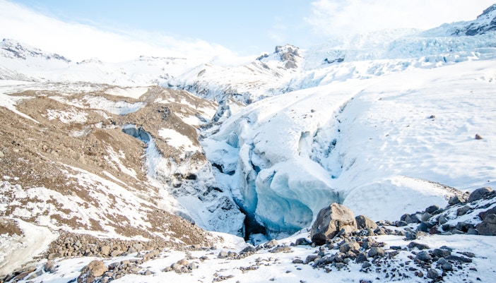 Falljokull glacier landscape in Iceland with snow-covered terrain and ice formations.