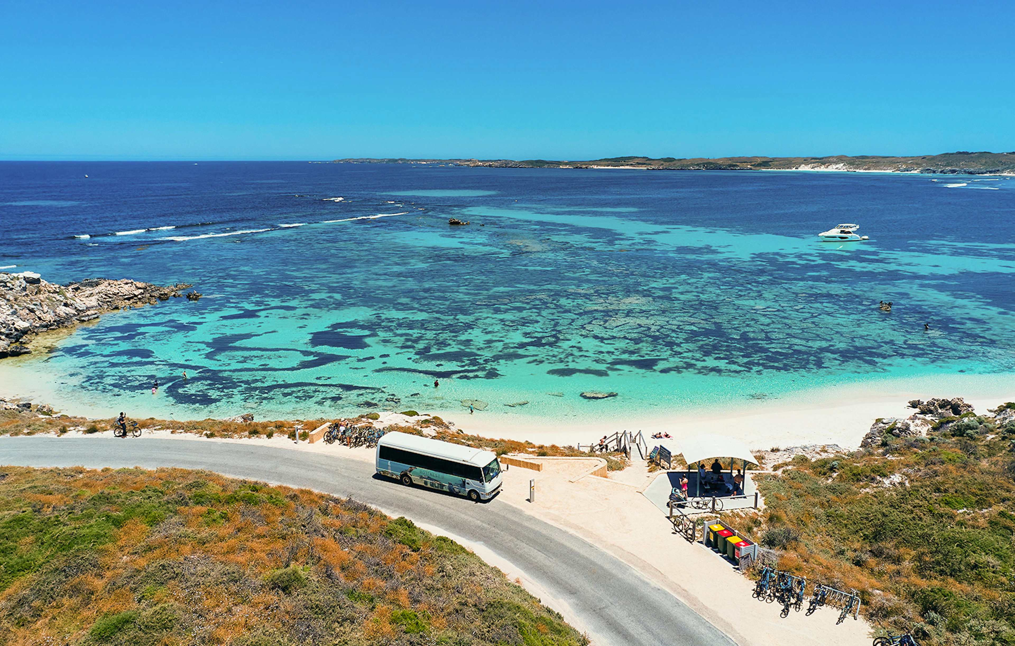 Tourists on a bus tour at Rottnest Island with coastline view, Perth or Fremantle return ferry.