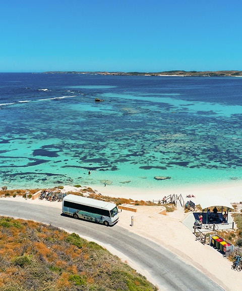Tourists on a bus tour at Rottnest Island with coastline view, Perth or Fremantle return ferry.