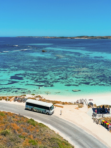 Tourists on a bus tour at Rottnest Island with coastline view, Perth or Fremantle return ferry.