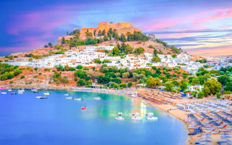 Lindos city at sunset with Acropolis view, Rhodes island, Greece.