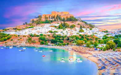 Lindos city at sunset with Acropolis view, Rhodes island, Greece.