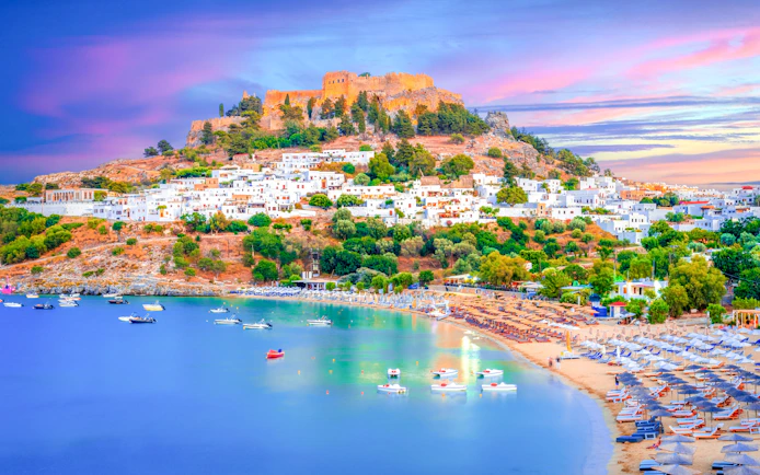 Lindos city at sunset with Acropolis view, Rhodes island, Greece.