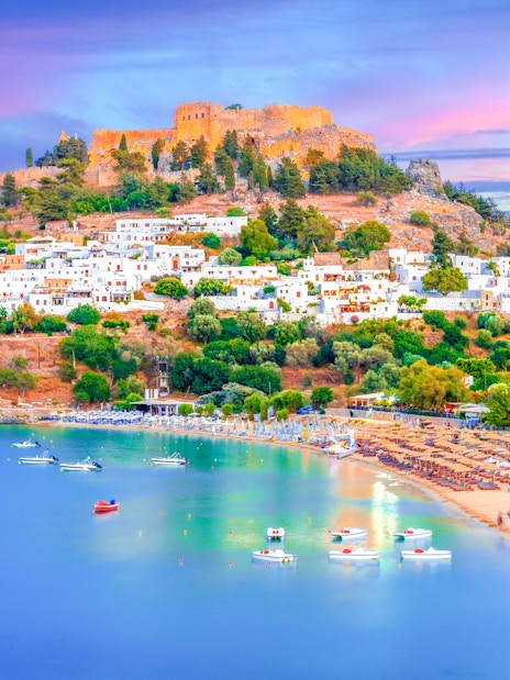 Lindos city at sunset with Acropolis view, Rhodes island, Greece.