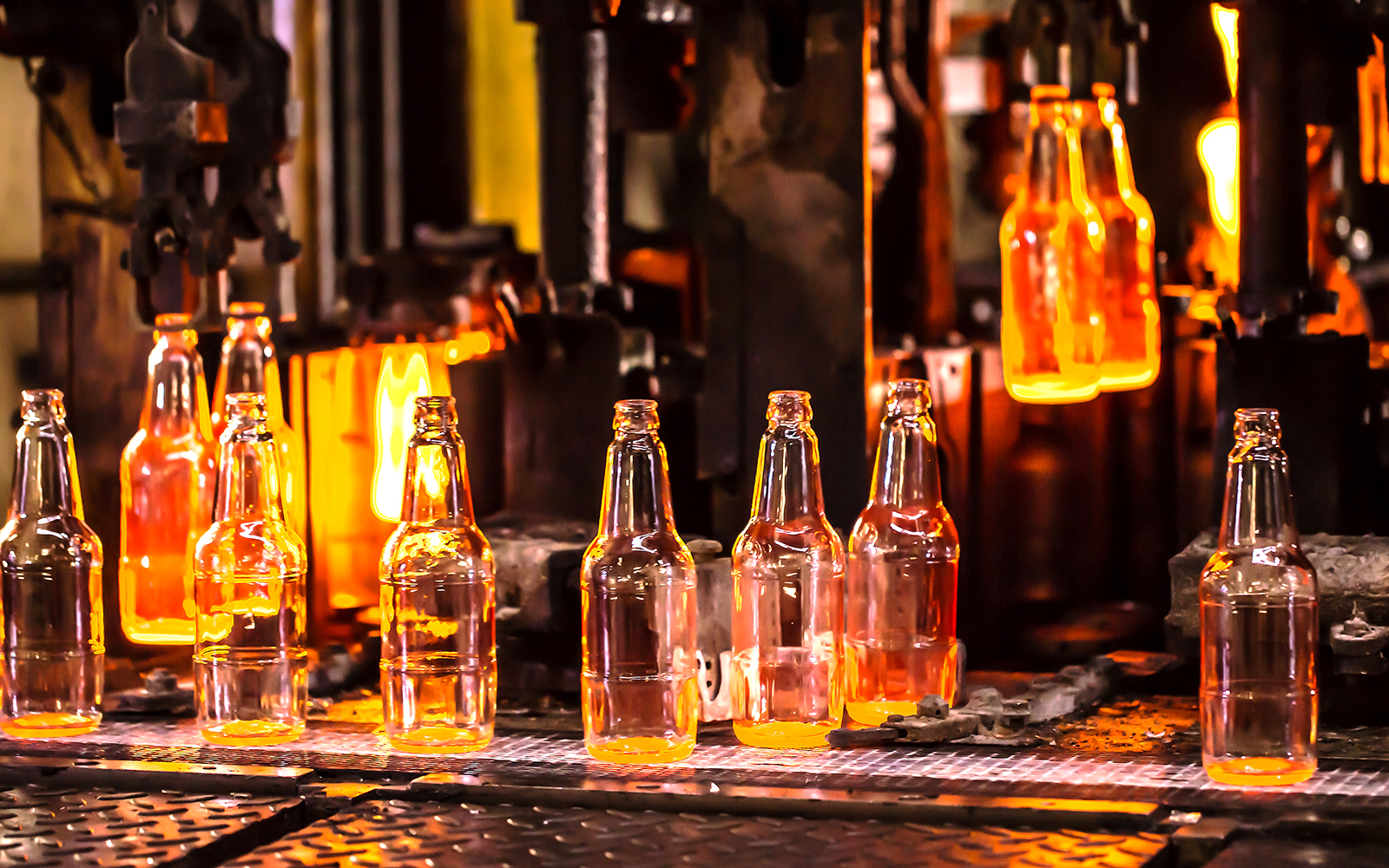 Glassblowers crafting glassware at Mdina Glass Factory, Malta.