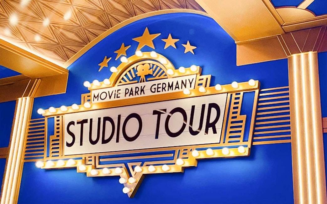 Movie Park Germany Studio Tour sign with lights and stars.
