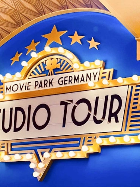 Movie Park Germany Studio Tour sign with lights and stars.