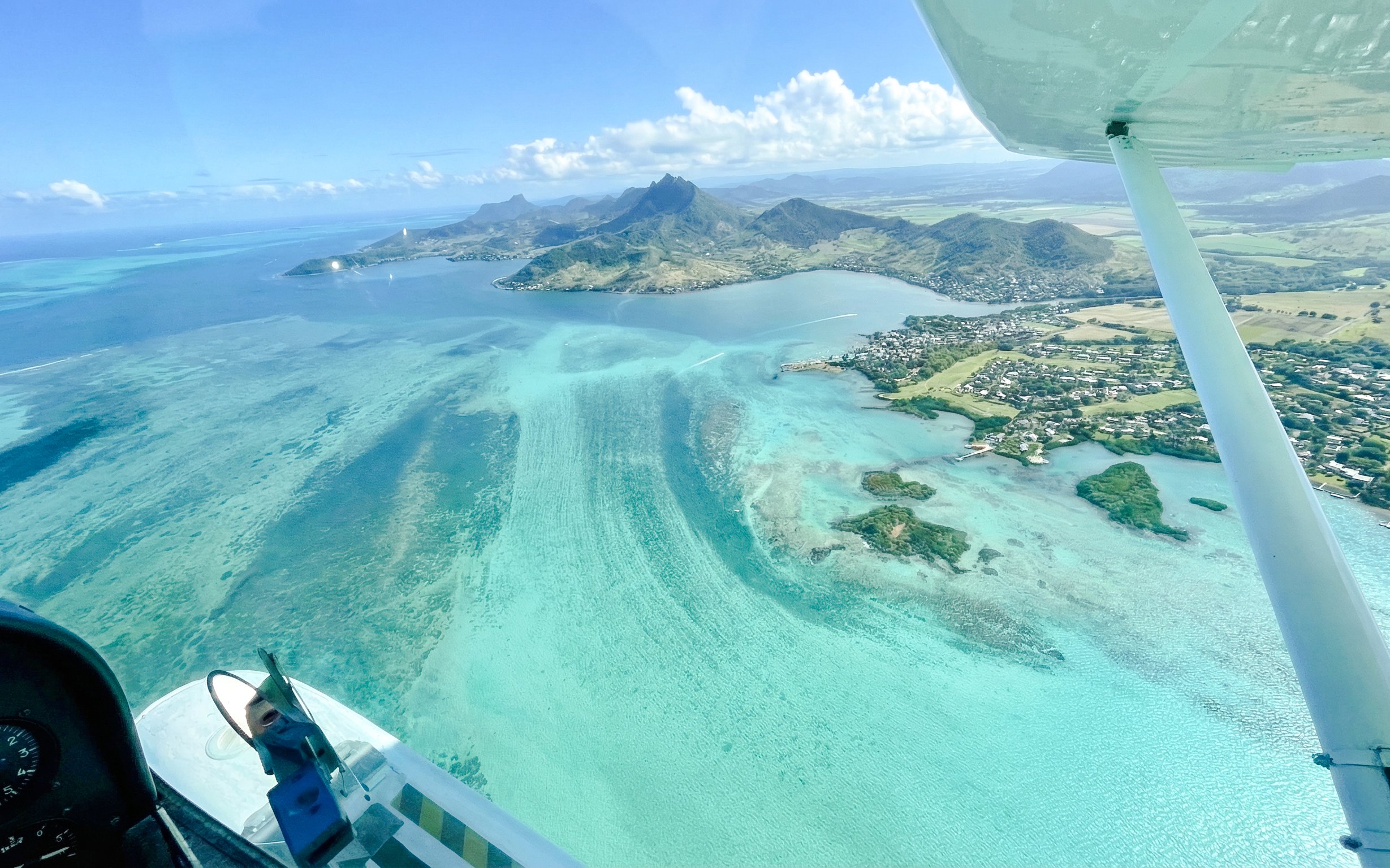 Aerial view of Mauritius coastline from seaplane on Eastern Underwater Waterfall route.