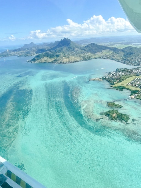 Aerial view of Mauritius coastline from seaplane on Eastern Underwater Waterfall route.