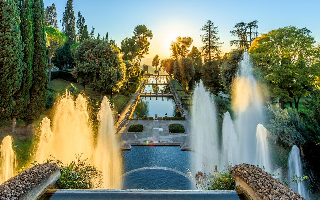 Villa d'Este fountains and pond at sunset in Tivoli, Italy.