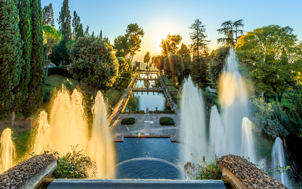 Villa d'Este fountains and pond at sunset in Tivoli, Italy.