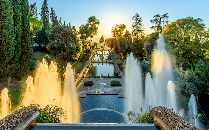 Villa d'Este fountains and pond at sunset in Tivoli, Italy.