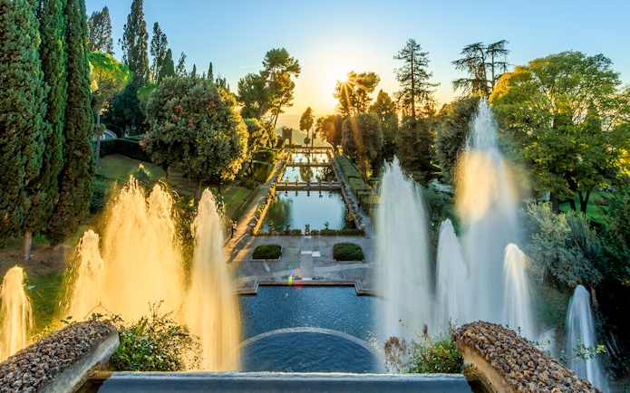 Villa d'Este fountains and pond at sunset in Tivoli, Italy.