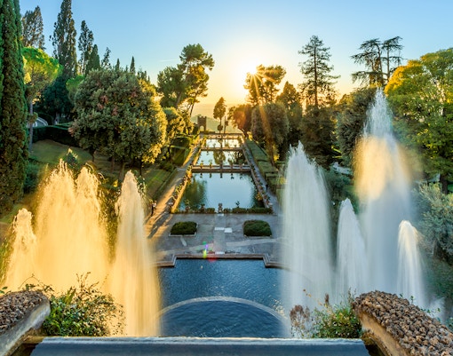 Villa d'Este fountains and pond at sunset in Tivoli, Italy.