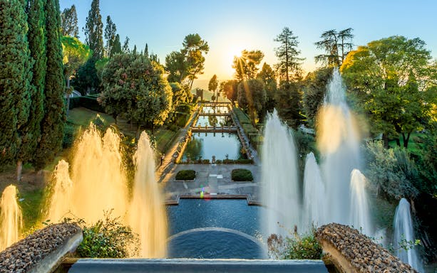 Villa d'Este fountains and pond at sunset in Tivoli, Italy.