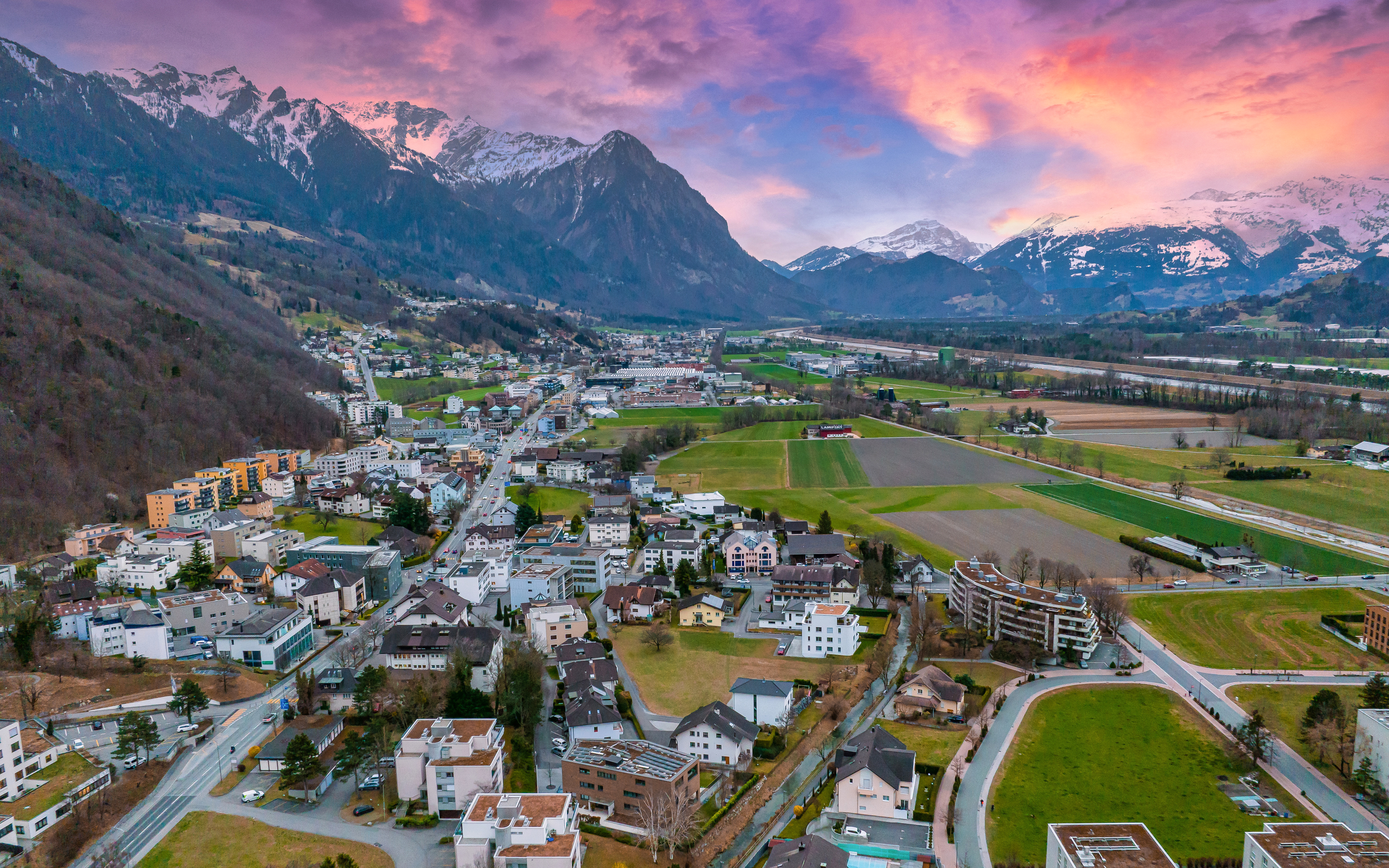 Aerial view of Vaduz, Liechtenstein with mountains and cityscape.