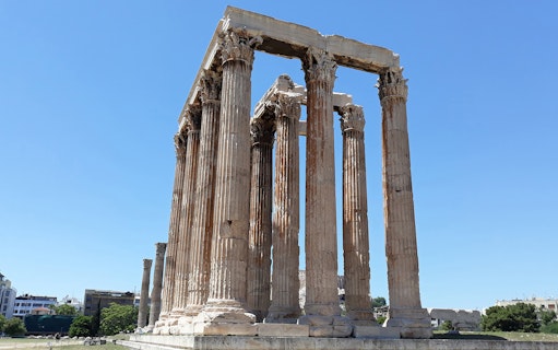 Temple of Olympian Zeus columns under clear sky in Athens.