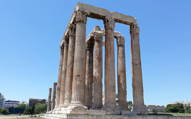 Temple of Olympian Zeus columns under clear sky in Athens.
