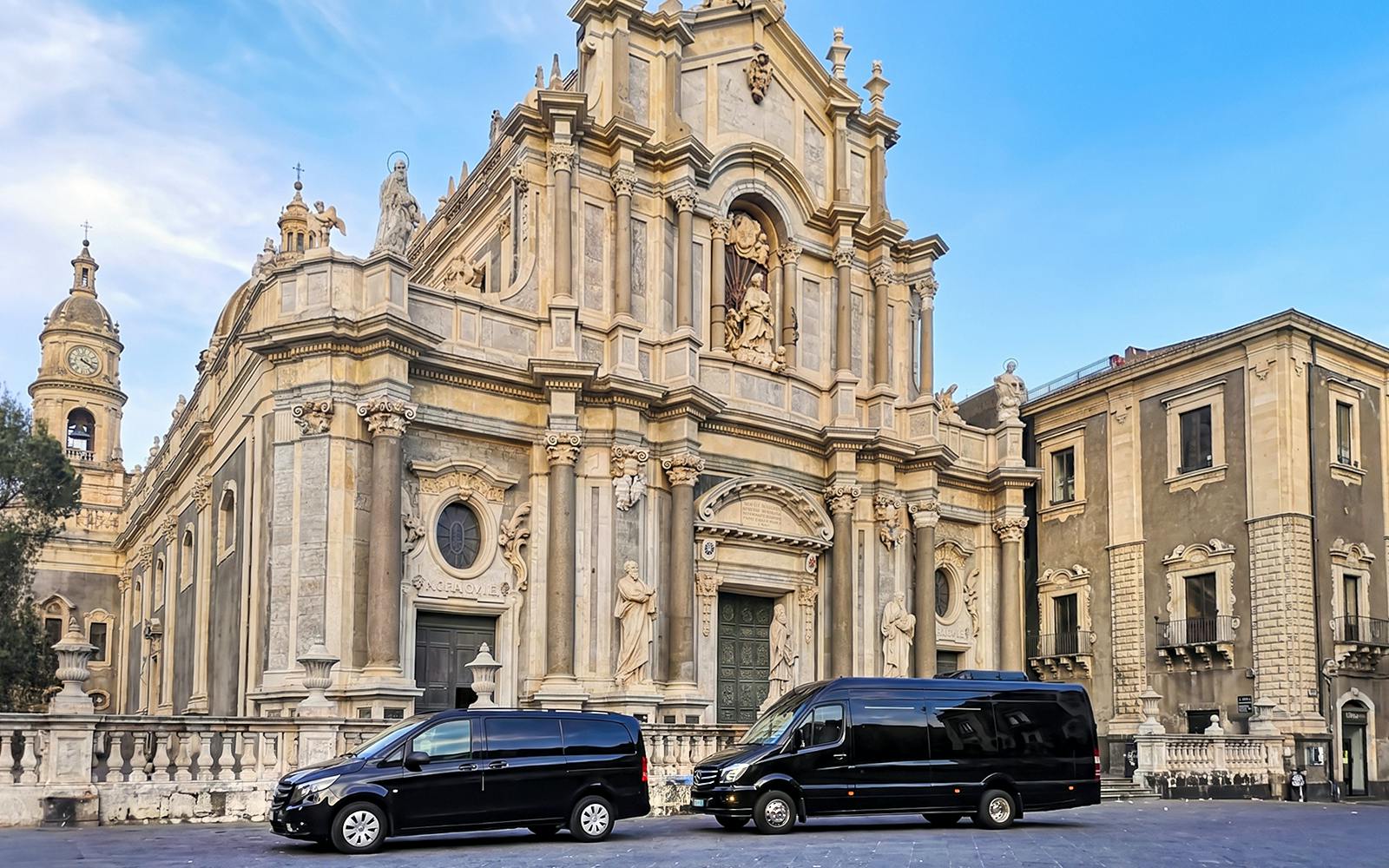 Savoca church with tour vans parked in front, part of Godfather sightseeing tour.