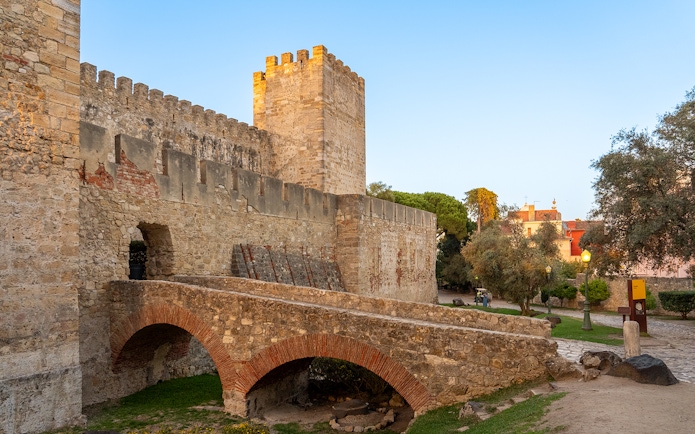 St George's Castle stone archways and walls in Lisbon, Portugal.