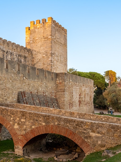 St George's Castle stone archways and walls in Lisbon, Portugal.