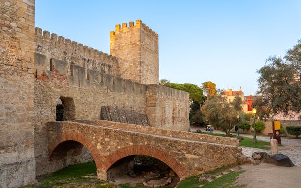 St George's Castle stone archways and walls in Lisbon, Portugal.