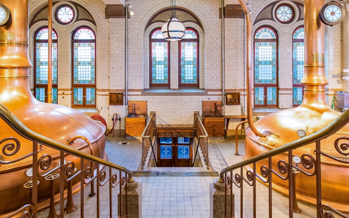 Copper brewing kettles inside the Heineken Experience in Amsterdam.