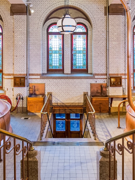 Copper brewing kettles inside the Heineken Experience in Amsterdam.