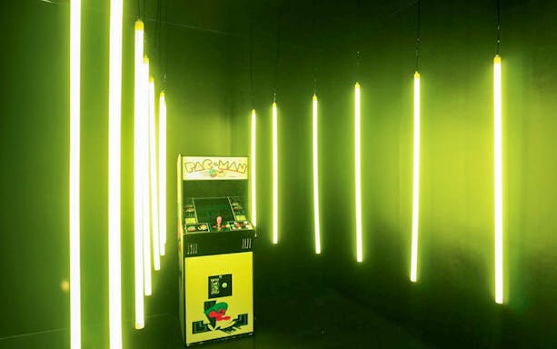 Arcade game machine with neon lights at The Selfie Experience Phuket.