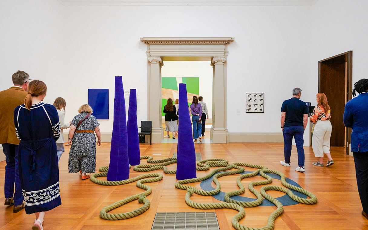 Visitors exploring modern art installations at Tate Britain, London.