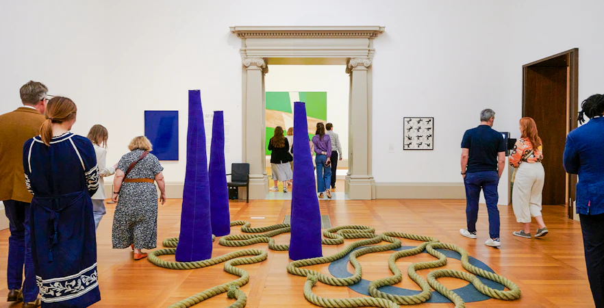 Visitors exploring modern art installations at Tate Britain, London.