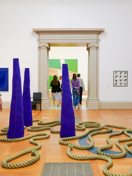 Visitors exploring modern art installations at Tate Britain, London.
