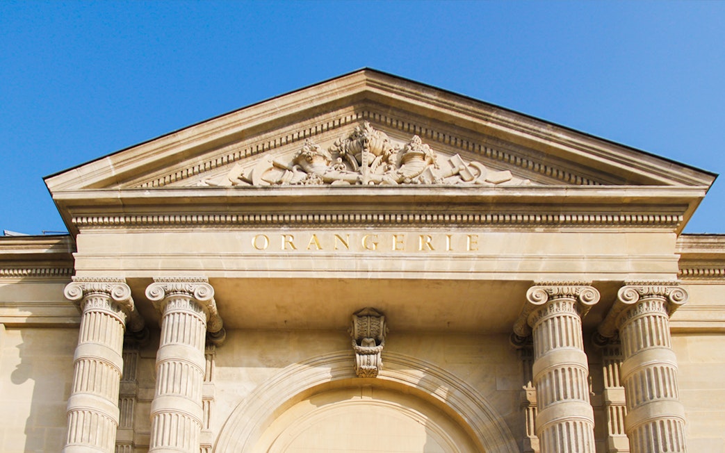 Orangerie Museum entrance with classical columns and detailed pediment in Paris.