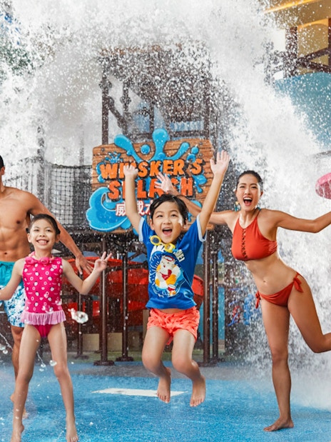 Family enjoying water play area at Ocean Park's Whiskers Splash, Hong Kong.