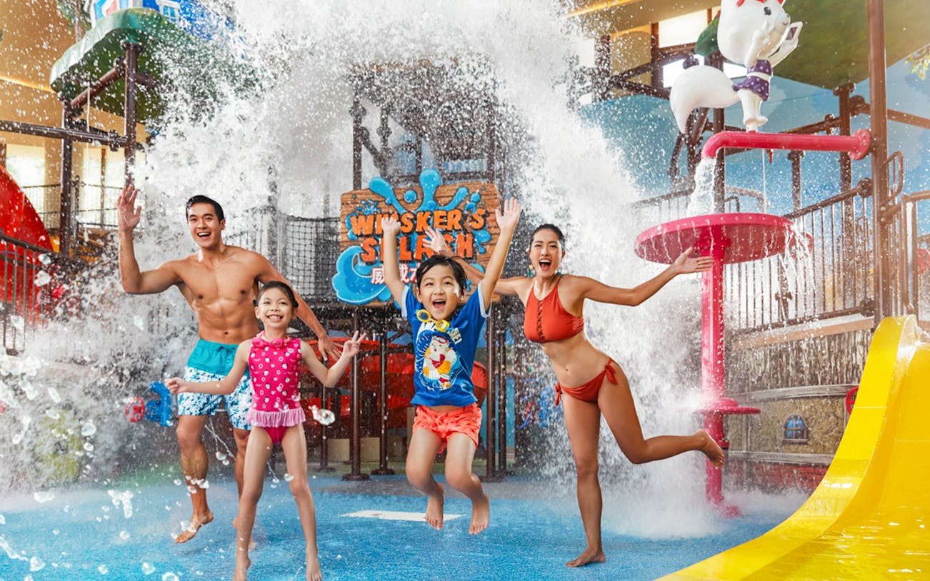 Family enjoying water play area at Ocean Park's Whiskers Splash, Hong Kong.