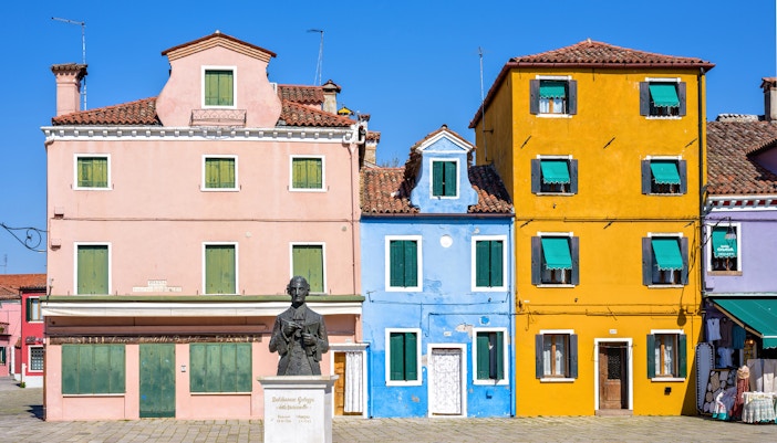Daylight view to vibrant colorful city buildings facade at Galuppi Sqaure