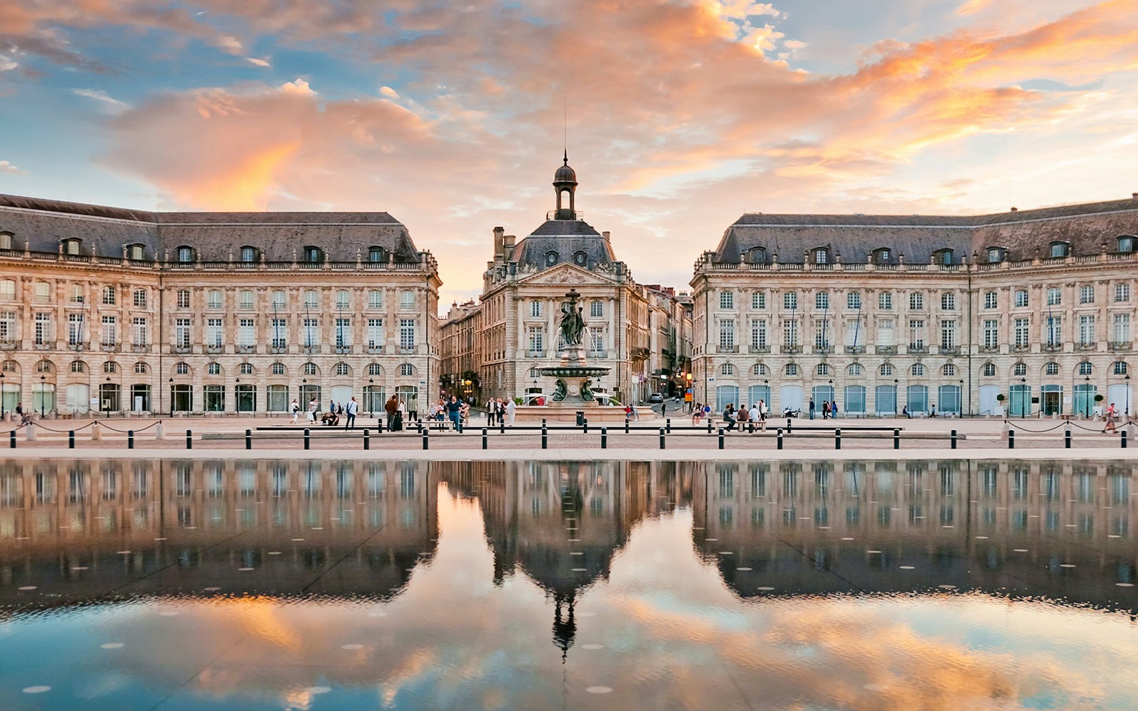 Place de la Bourse in Bordeaux with reflecting pool at sunset.