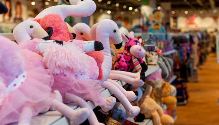 Plush flamingo toys on display
