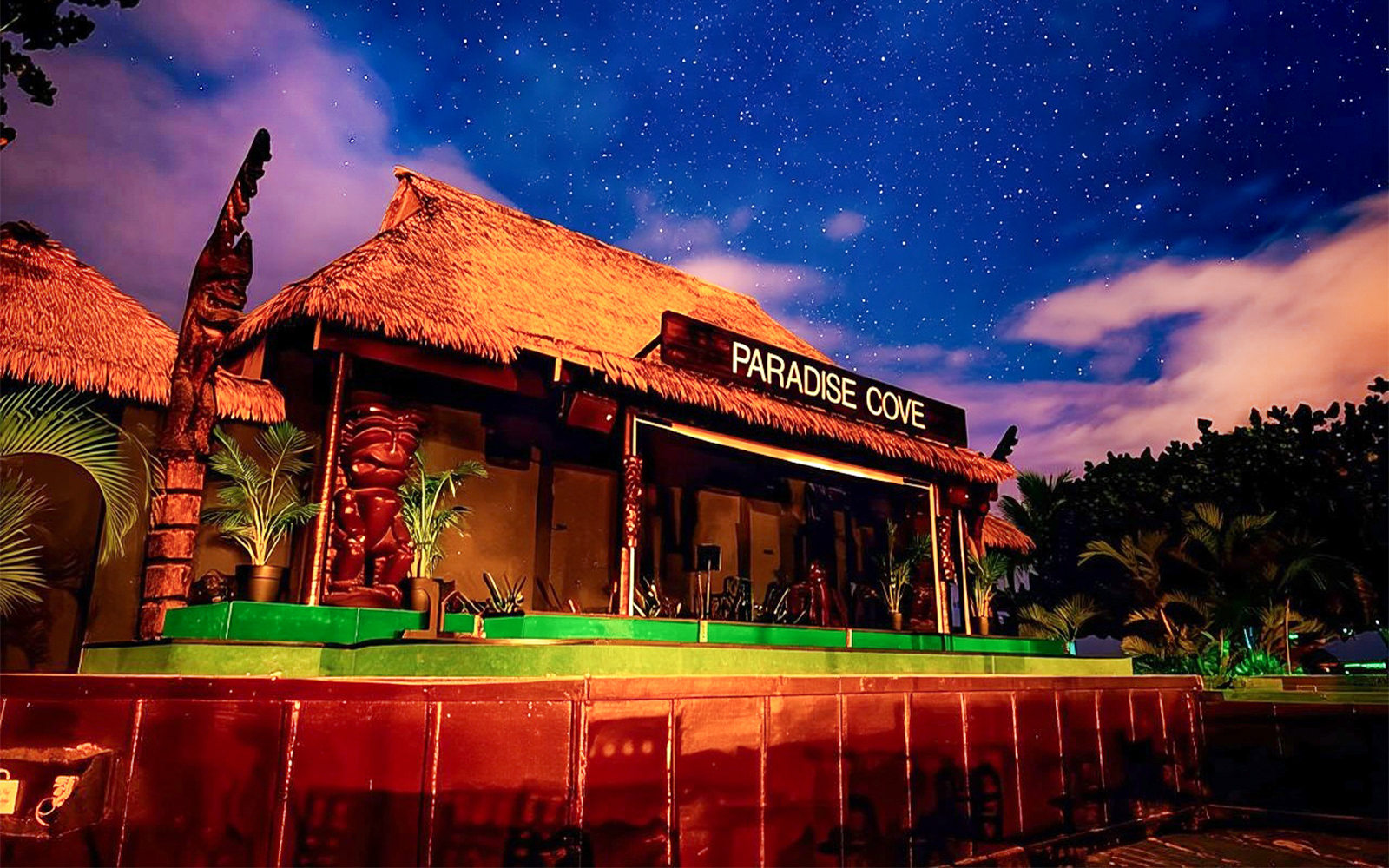 Paradise Cove stage under starry sky, Hawaii.