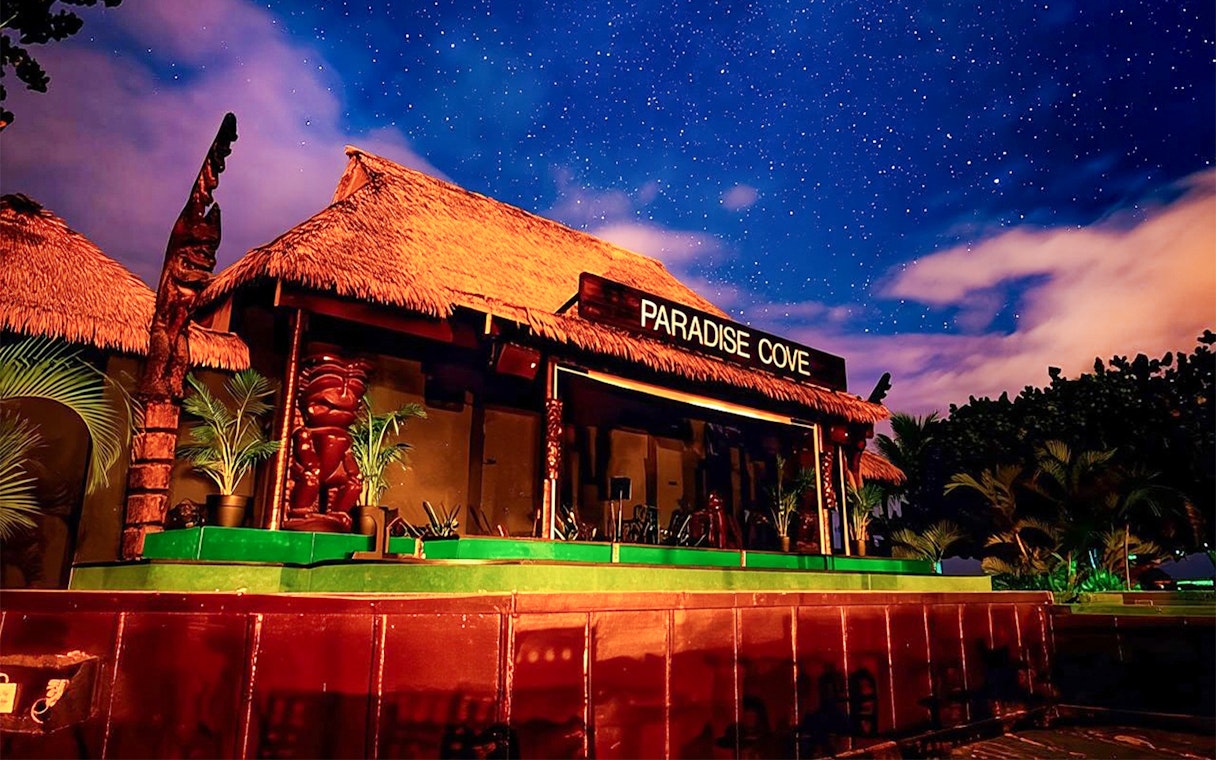 Paradise Cove stage under starry sky, Hawaii.