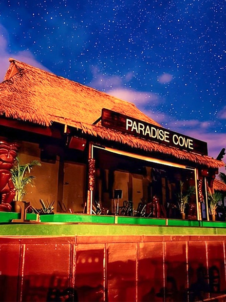 Paradise Cove stage under starry sky, Hawaii.