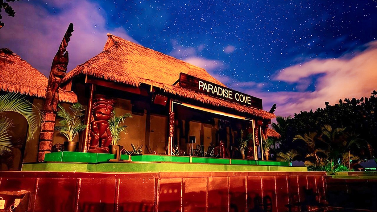 Paradise Cove stage under starry sky, Hawaii.