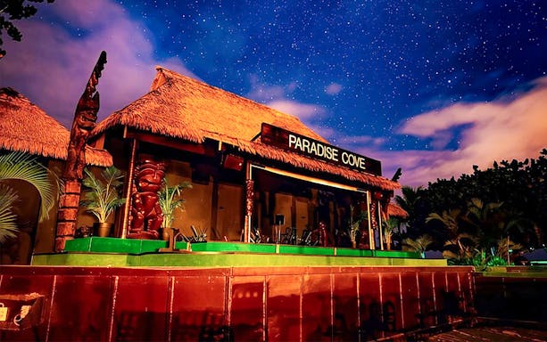Paradise Cove stage under starry sky, Hawaii.