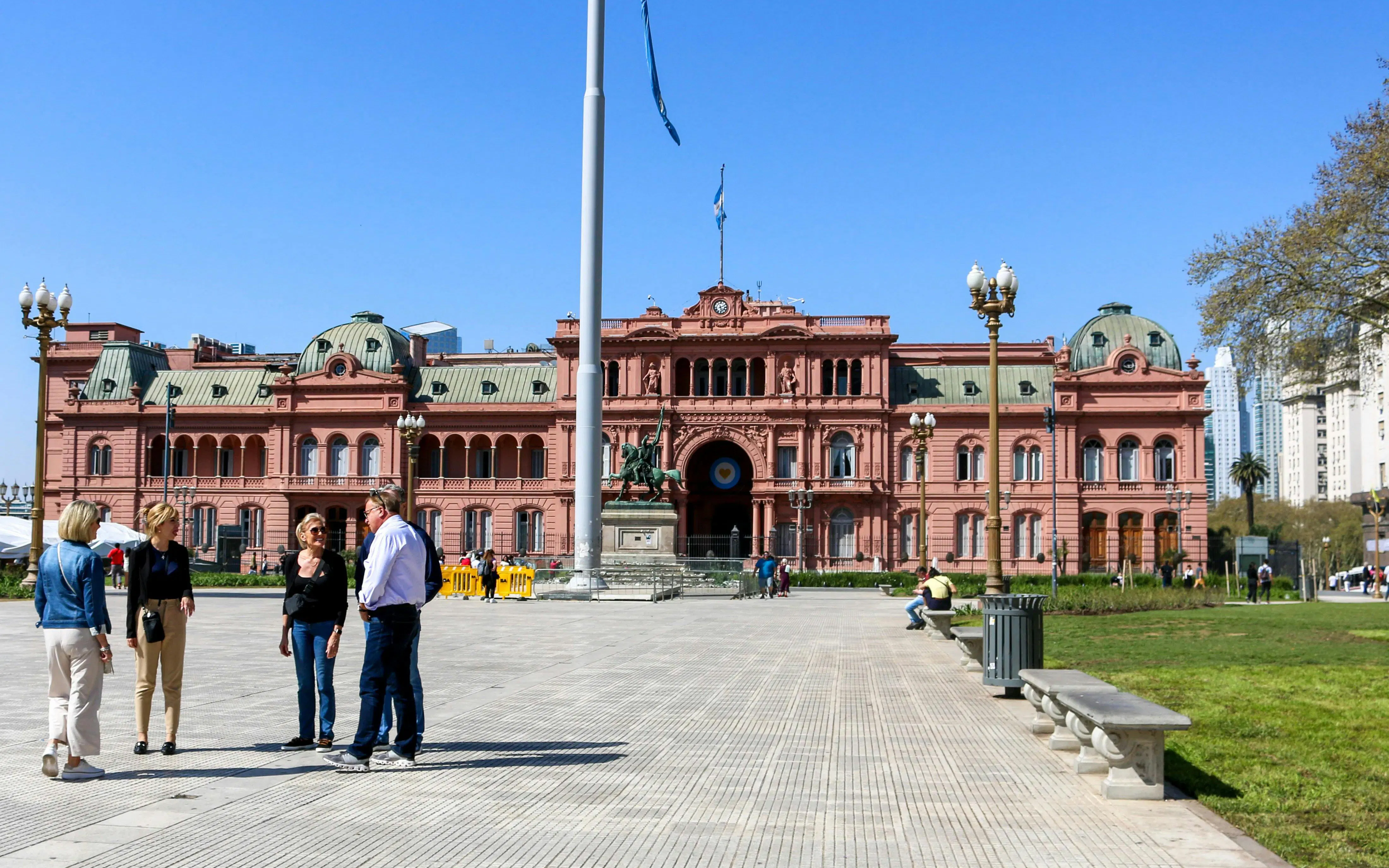 Casa Rosada in Buenos Aires with people gathered in the foreground.