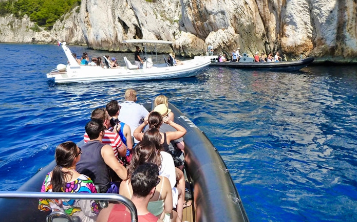Speedboats with tourists near blue caves in Croatia.