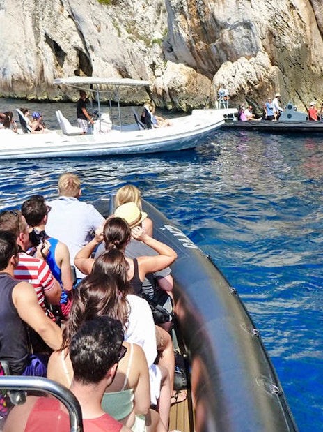 Speedboats with tourists near blue caves in Croatia.