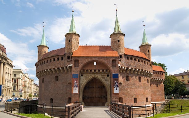 Krakow Barbican with towers and gate, part of Small Group Guided Tour from Warsaw.