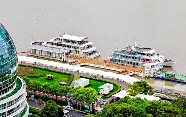 Aerial view of cruise ships docked near Oriental Pearl Tower, Shanghai.